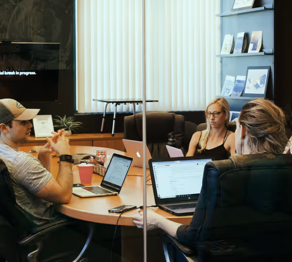 Architects and project managers reviewing construction plans together